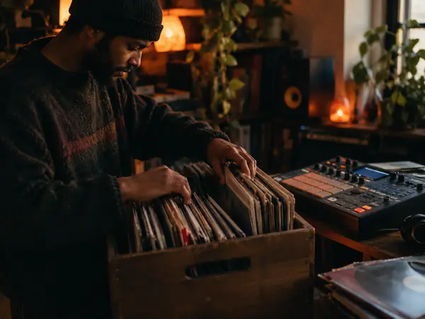 A producer digging through records